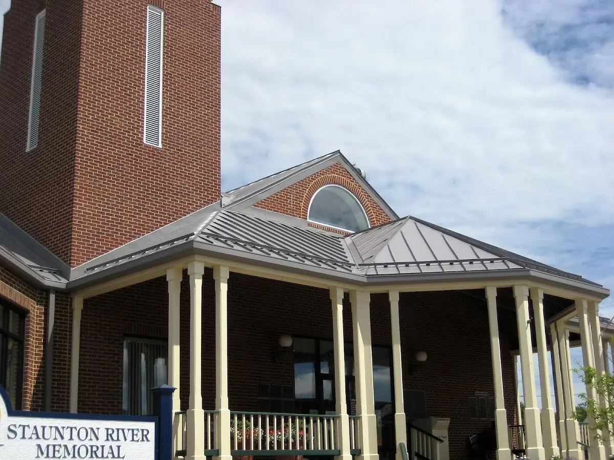 Skilled roofing craftsmen working on a residential roof in Seeneytown